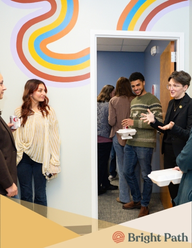 Professional headshot of person in business attire against neutral background